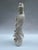 A single Chinese porcelain "blanc de chine" figure of a guan yin on a round base.