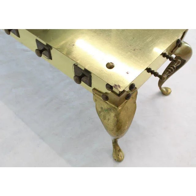 Unusual all solid brass reinforced with studs long rectangle coffee table.