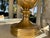 A refined pair of classical decorative table lamps executed in an Antique Burnished Brass finish, distinguished by an...
