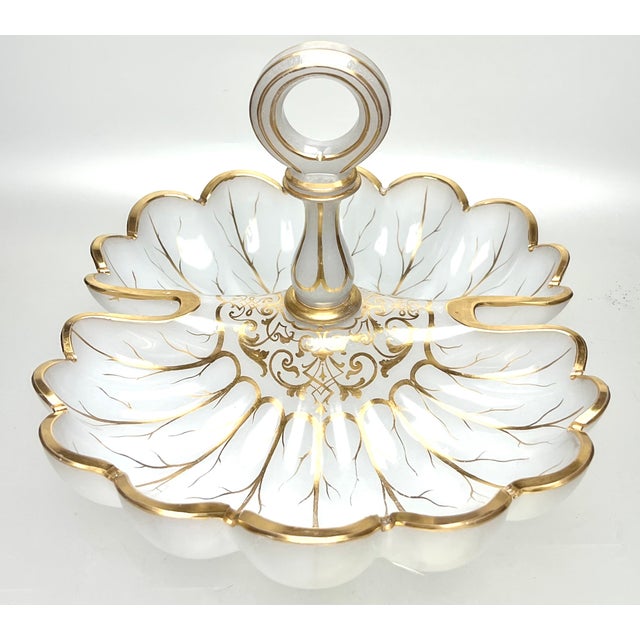 A stunning French translucent white glass serving dish/fruit bowl, circa 1880s, having a lavishly hand painted designs in...