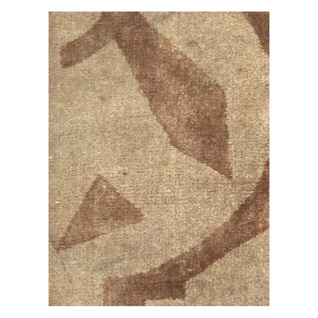 A vintage English Art Deco style throw rug handmade during the mid-20th century in shades of brown. Measures: 1' 3" x 2' 3".
