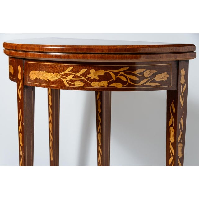 Lovely Dutch fold over gaming table. Green felt lined center. 32"W when open. Marquetry details. Brass hardware