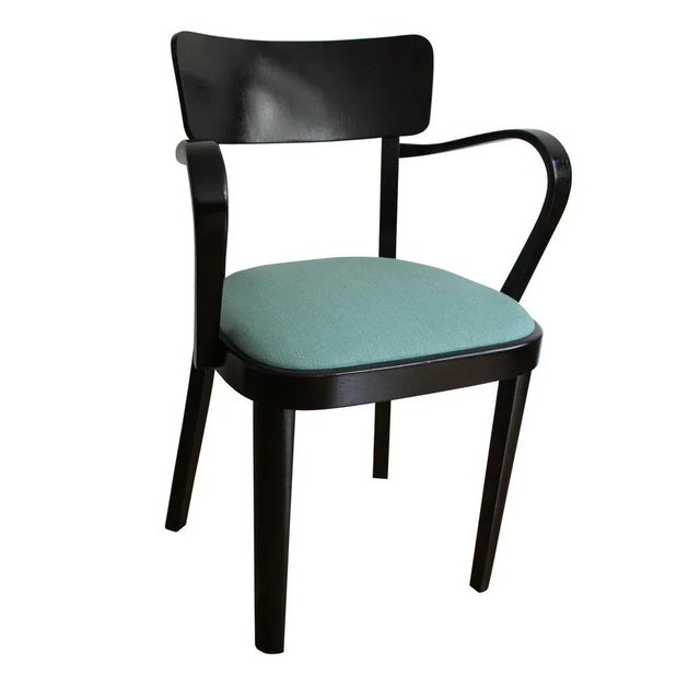 This is an original chair produced the late 1940’s. The chair doesn’t have a company label anymore but we believe it was...