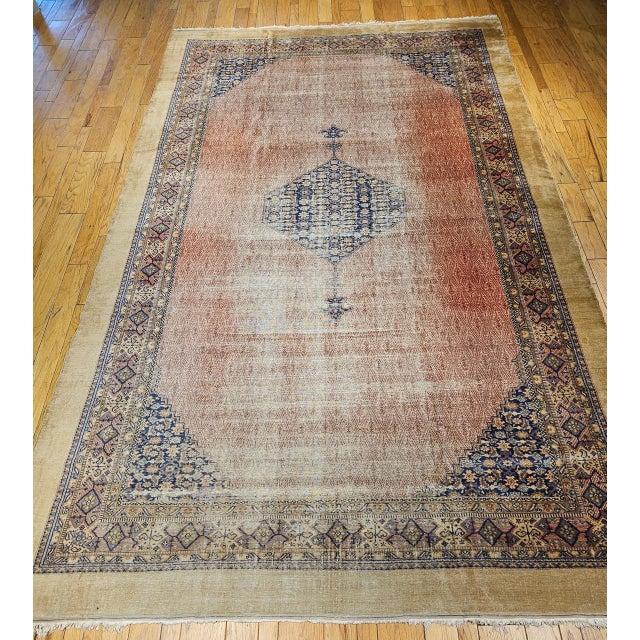 "This exceptional early 20th century Persian Malayer camel hair rug in an impressive gallery format is one of the finest...