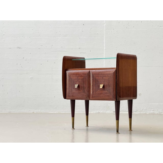 This elegant pair of bedside tables combines high-quality materials with the clean lines of the 1960s. Crafted from warm,...