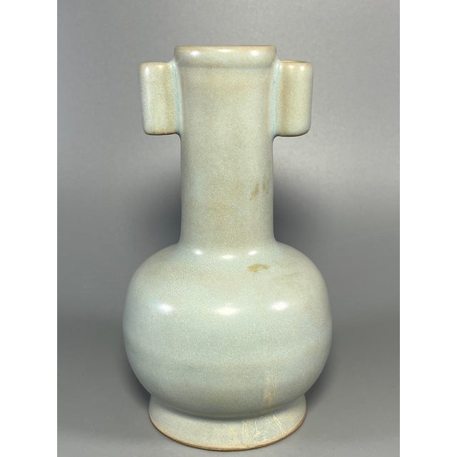Beautiful antique Chinese celadon porcelain vase with two tubular ears on the neck. Smooth pale‑green glaze with subtle...