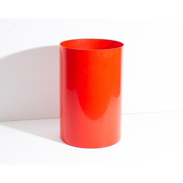 A vintage waste basket produced by Ingrid Ltd. Made of red plastic, this waste basket has a simple and minimalist...