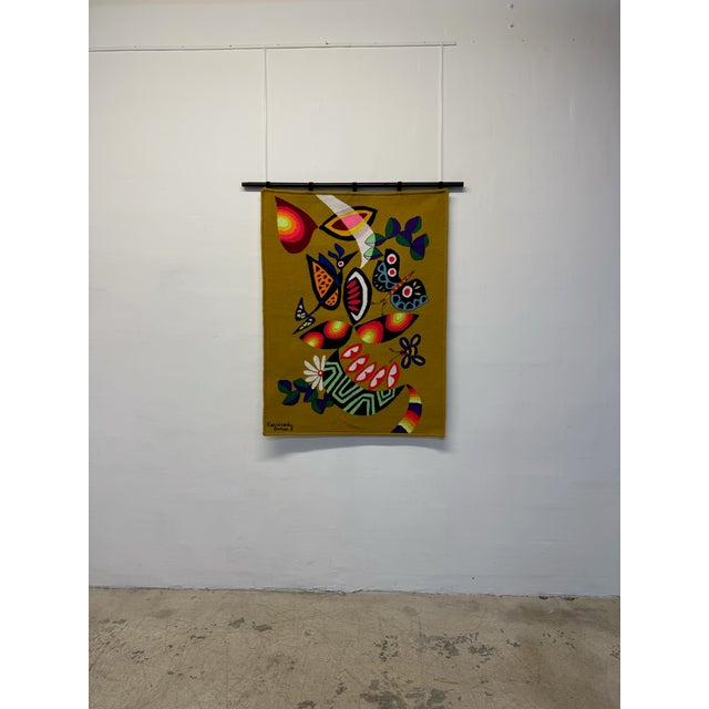 Woven wall tapestry by Brazilian textile artist Kennedy Bahia circa 1980. Hummingbird, butterflies and flowers. “Known...