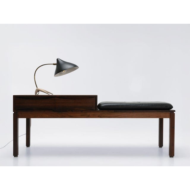 This table lamp is easily identified by its tripod base, which resembles a crow's foot. Moreover, the base has a...