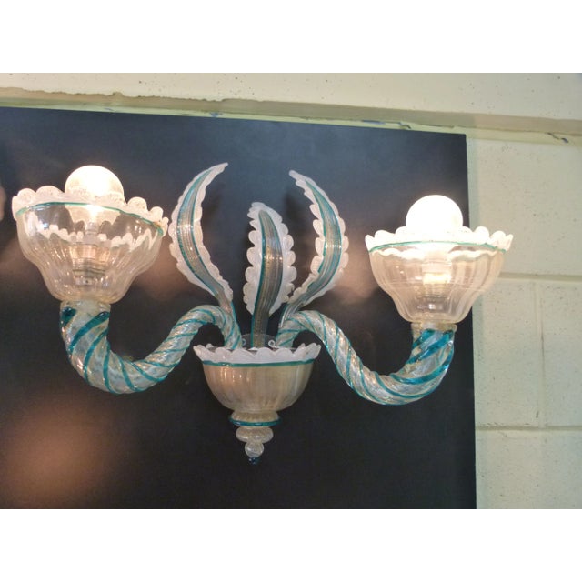 These gold and green Murano glass wall lights were produced by Avem in the 1960s. This piece is attributed to the...