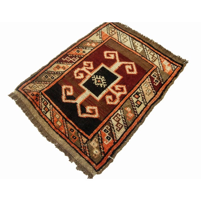 Vintage Handknotted decorative mini rug from Kars region of Turkey. Approximately 45-55 years old. In very good condition.