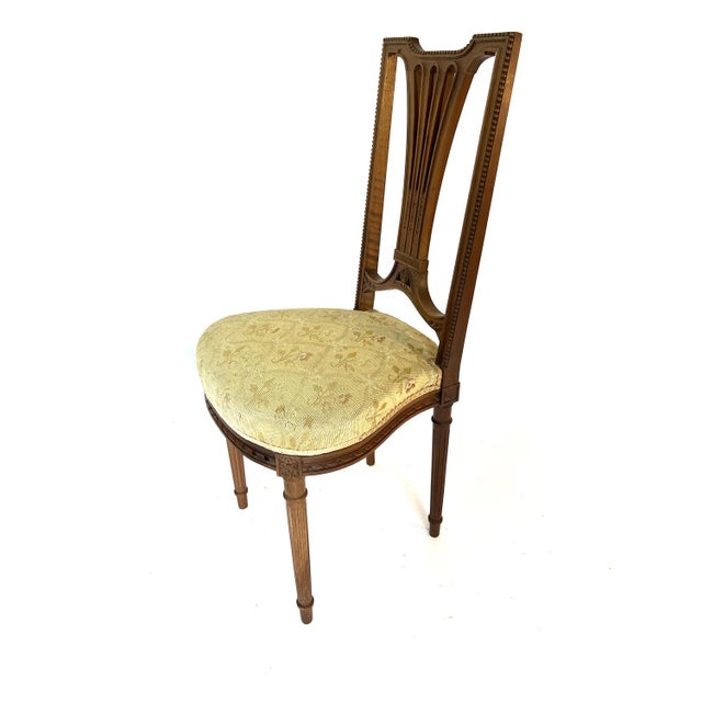 Pair of walnut chairs from the 1930s, Louis XVI style. The backrest is finely carved, with an outline decorated with...