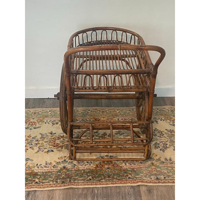Offered is a vintage rattan French Riveria Bar Cart attributed to famous French designers Adrien Audoux and Frida Minet....