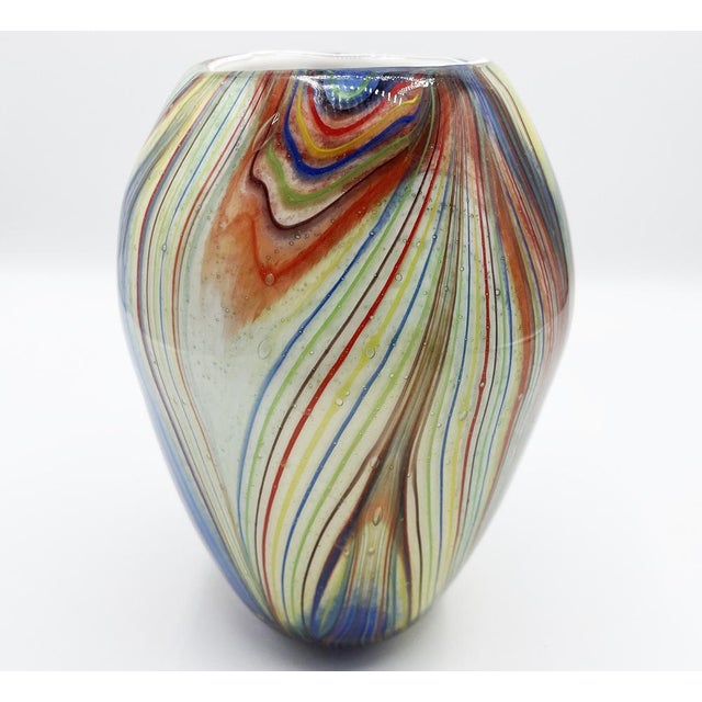 This multicolored striped vetro incamiciato vase embodies the beauty and excellence of Murano’s glassmaking tradition....