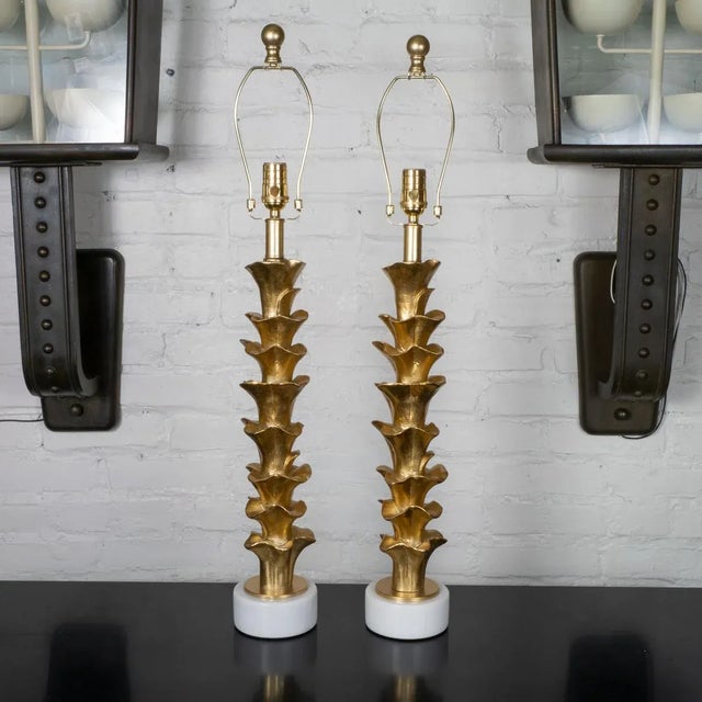 Pair of organic form composition table lamps on stone bases with golden gilt-like finish.