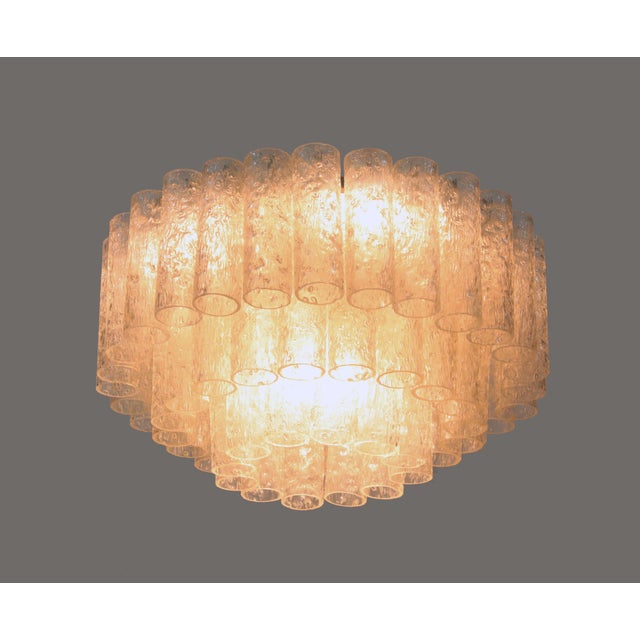 Elegant large three-tier murano flush mount chandelier with clear murano glass tubes on a white laquered metal frame....