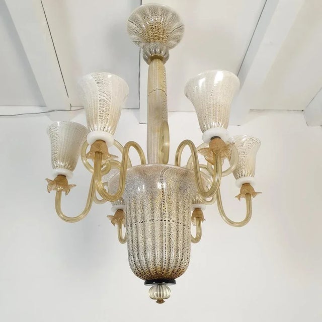 Tall Mid-Century Murano glass chandelier, attributed to Venini, Italy 1960s. The chandelier is made of a white and brown...