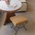 Beautiful iron stools with curved and looped base painted in a matte black finish. Rectangular cushioned seat upholstered...