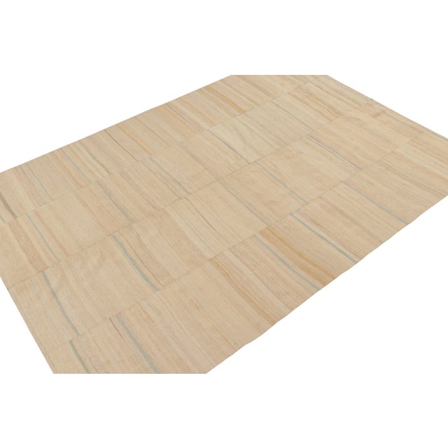 This vintage 7x10 Persian kilim is a panel-woven tribal rug, handwoven in wool circa 1950-1960. Its colorway enjoys beige-...