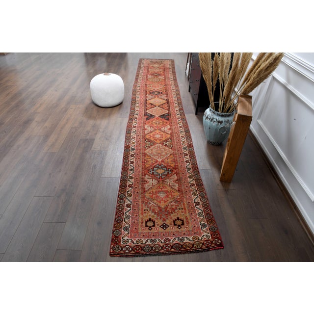 Vintage Hand-Knotted runner rug is a semi-antique vintage runner rug. The '70s Eastern region of Anatolian's unique rug is...
