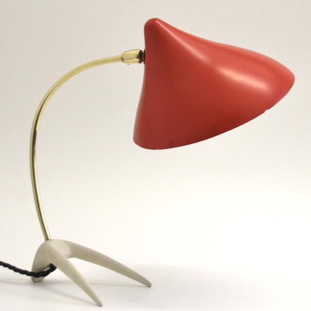 Very rare, unusual "crow's foot" table lamp consisting of solid brass and an elegant reflector shade in an elegant...