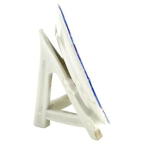 Menu holder featuring a floral plate on an attached plate stand. Maker's mark on backside. Minor wear.