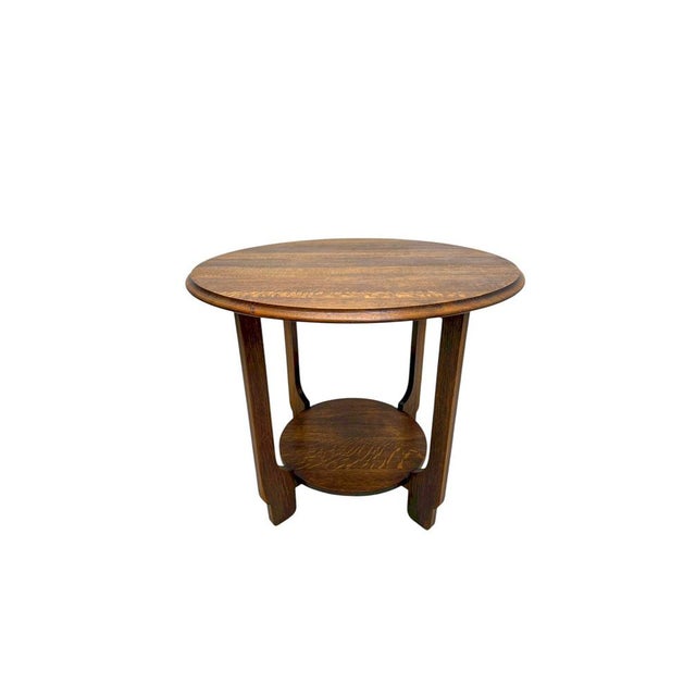 Oak coffee table or side table from the 1920s-1930s. The style is Art Deco, Amsterdam School. The shape is elegant and...