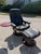 Black leather Ekornes Stressless chair & Ottoman with swivel table. The chair features a swivel base and reclining...