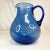 This is a Cobalt Blue beverage pitcher from the 1980s. It features hand. Lawn glass in the lovely Art Deco Cobalt style....