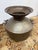 Design Plus Gallery presents a Cooper Water Vessel with Rope Handles. This vessel has a rounded body, flared rim, hammered...