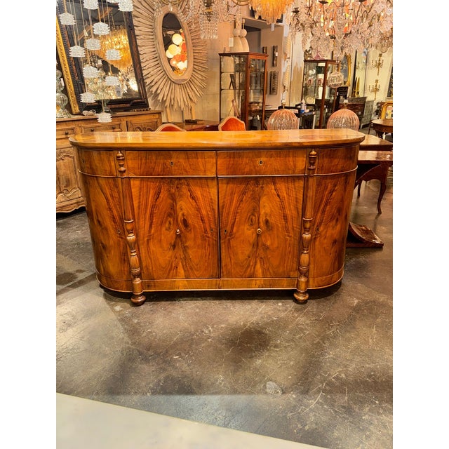 The 19th c. Italian Walnut Buffet is a stunning piece of antique furniture crafted from high-quality walnut wood. Its...
