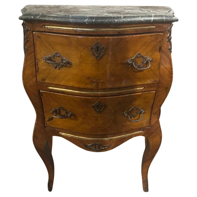 This authentic Italian chest of drawers dates from the Louis XVI period and showcases classic elegance. It features a...