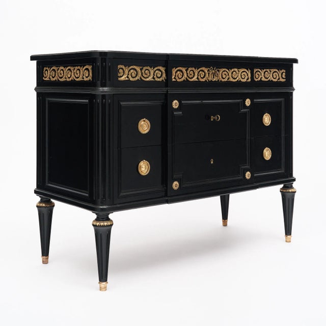 Chest of drawers in the Louis XVI style from France. This piece has been ebonized and finished with a lustrous museum-...