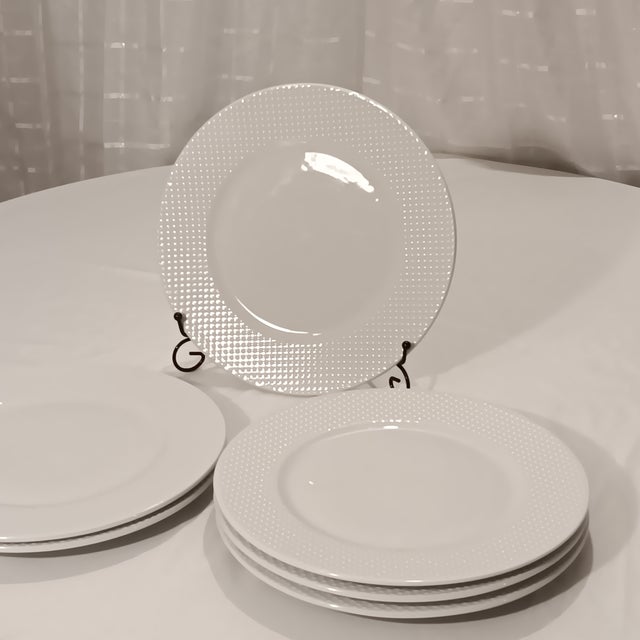 Timeless white dinner plates with decorative embossed dots around the border. Unbranded, all occasions, formal or casual....