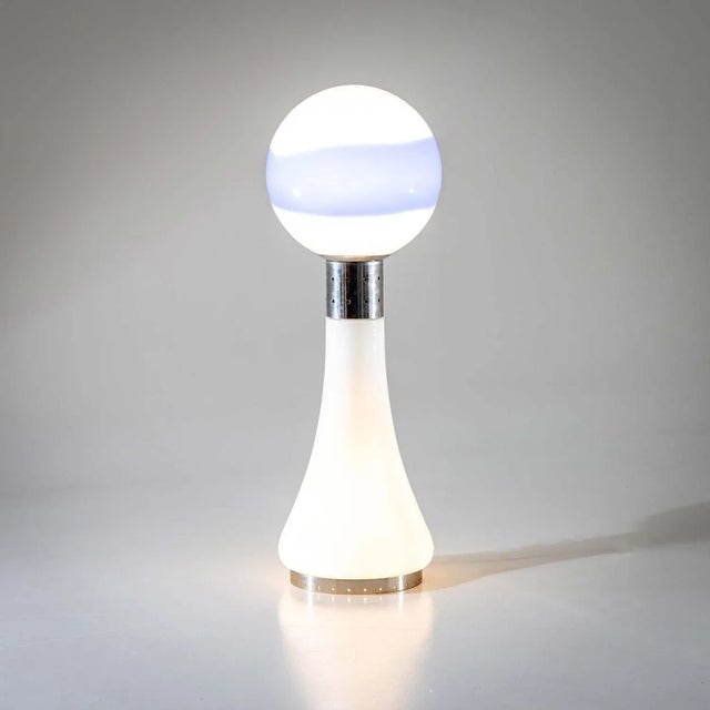 Floor lamp made of frosted glass body with metal mounting and blue striped inclusion. The lamp was designed by Carlo Nason...
