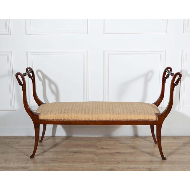 An elegant Neapolitan Empire bench crafted in solid mahogany, dating to the second half of the 19th century. Exemplifying...