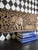 Large hand-carved teak wall panel from Thailand featuring an elephant and rider surrounded by elaborate floral and...