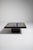 An artistic coffee table featuring eglomisé glass, a technique involving reverse-painted glass for decorative effect. The...