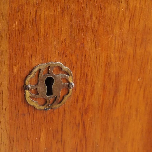 This mid-century wardrobe likely dates from around 1960 and follows the functional design language of post-war modernism,...
