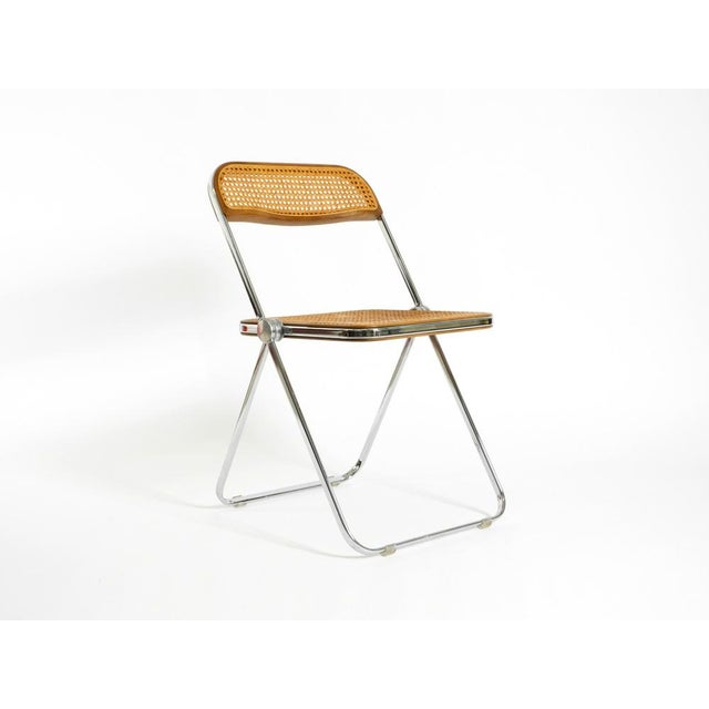 Rare original 1970s Plia folding chair with Vienna straw (cane) detailing. Designed by Giancarlo Piretti for Castelli in...