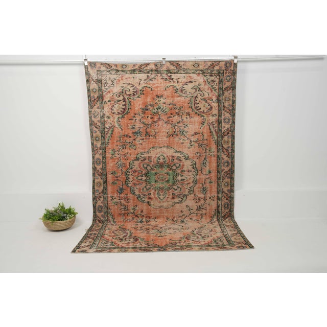 Vintage Hand-Knotted runner rug is a semi-antique vintage area rug. The '70s Eastern region of Anatolia's unique rug is...