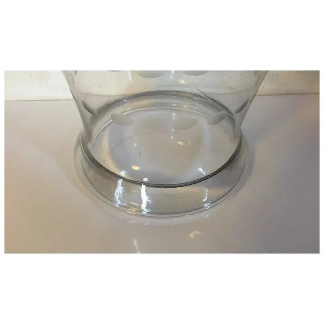 An exceptional 19th c. blown glass hurricane shade with a rolled foot and cut garlands of flowers and bows. These are...