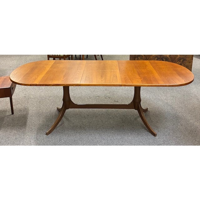 Item #AH52 Mid Century Modern Extending Teak Oval Dining Table on Double Pedestal Base One Butterfly Leaf. U.K. Import c.1960