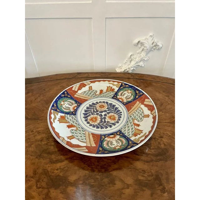 Large antique Japanese quality Imari charger having quality hand painted panels with flowers, leaves, trees, birds and...