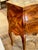 The 19th c. Italian Walnut Bombe Side Table is a charming piece of furniture with an inlaid pattern and a marble top. A...