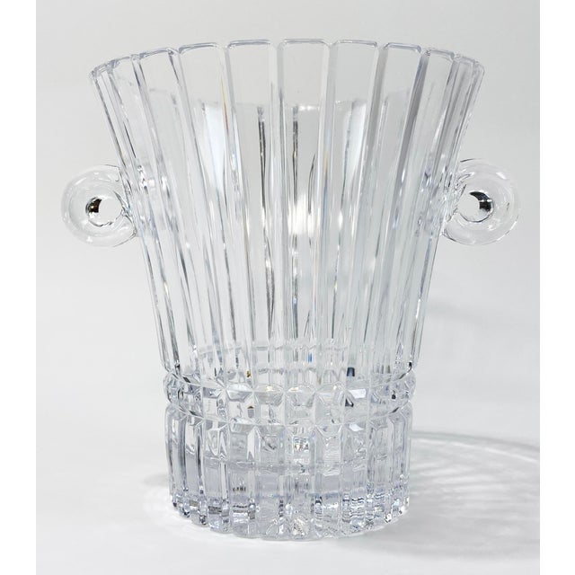 Substantial vintage fluted cut glass ice bucket or champagne bucket featuring rounded blown glass handles and intricately...