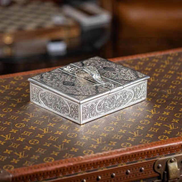 Antique 19th century victorian solid silver cigar box. Elegantly crafted, this box features a shaped central handle and...