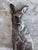A charming fox to keep the door from swinging closed. Made of cast iron and painted silver. Has wear typical of age.