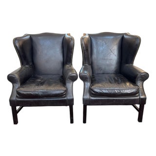 Pair of Vintage Black Leather Wingback Chairs With Brass Nailhead Trim For Sale