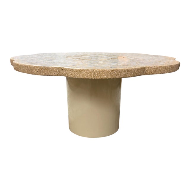 Striking vintage coffee table featuring a thick scalloped terrazzo-style top with an inset marble mosaic design. The...